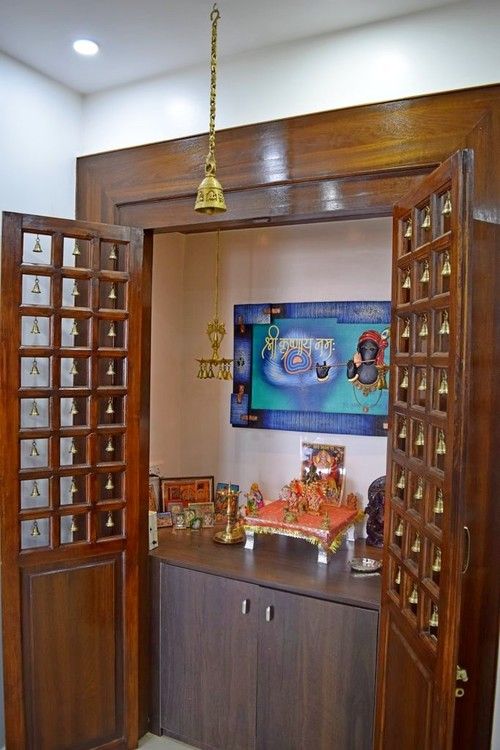 an open door leading into a room with jewelry on the table and decorations hanging from it