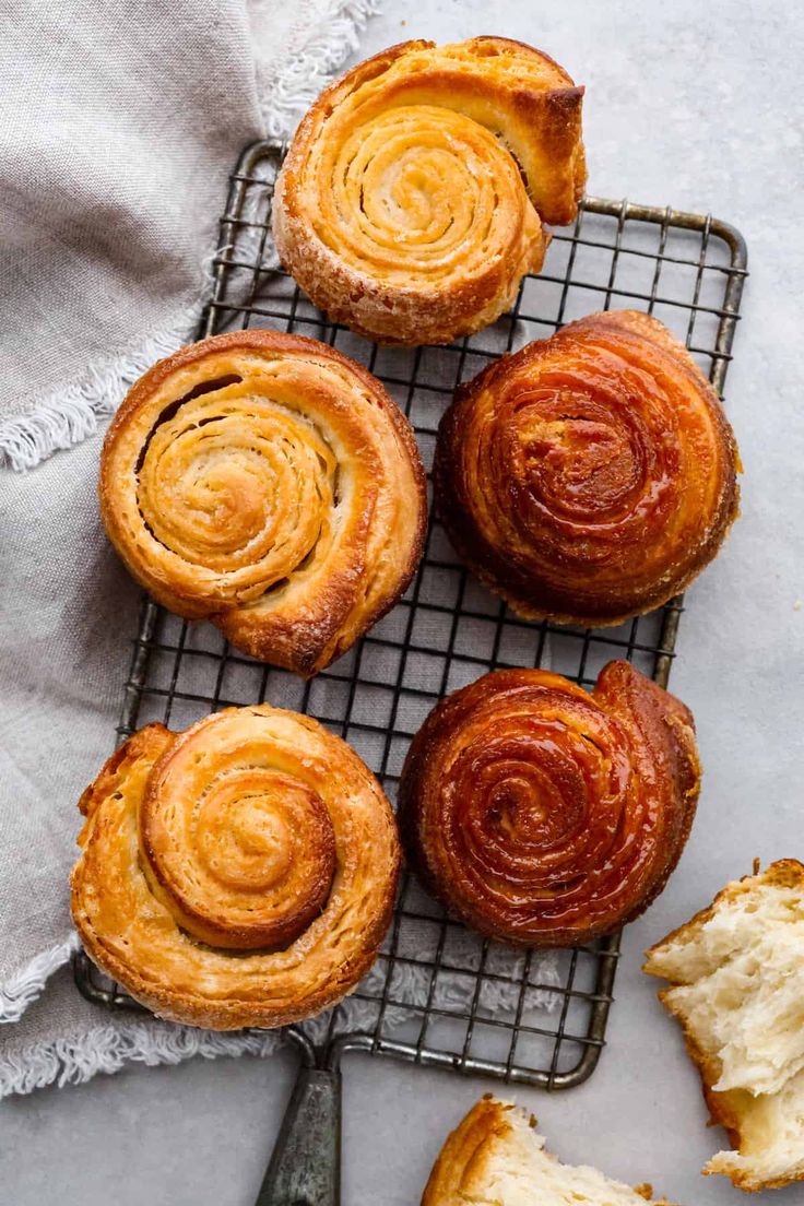 several pastries sitting on top of a cooling rack