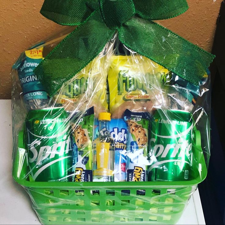 a green basket filled with snacks and drinks