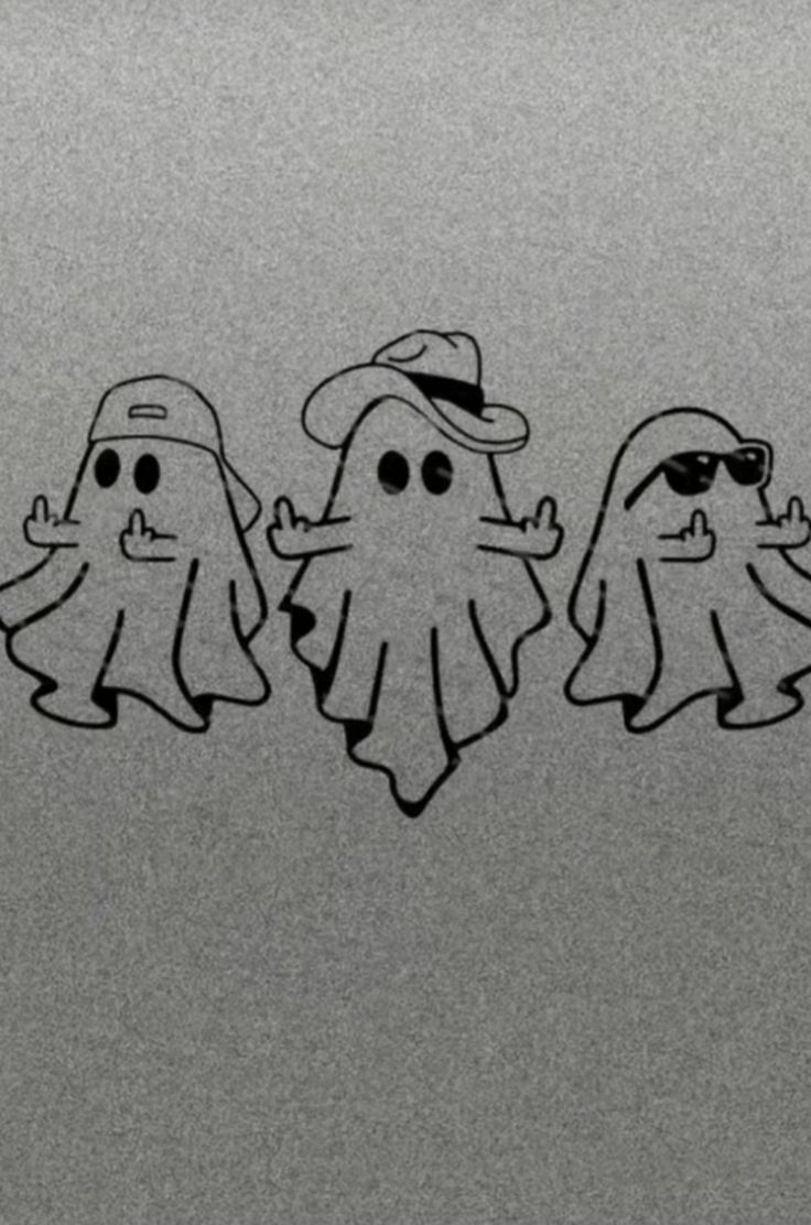 three ghost stickers are on the side of a refrigerator door, one is wearing sunglasses and the other has a hat