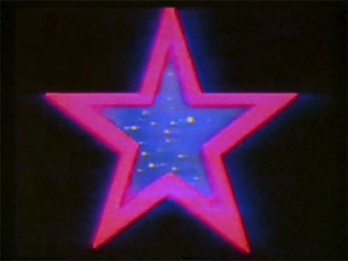 a red and blue star on a black background