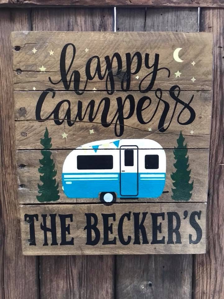 a wooden sign that says happy campers the becker's with an rv on it