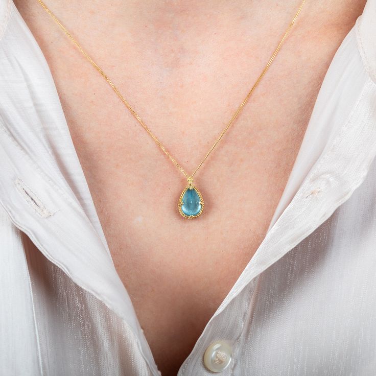 Reminiscent of a cloudless blue sky, this Aquamarine necklace adds a tiny hint of color to your outfit. We set this stone in a handmade 18k gold bezel with prongs. Technical Details Metal: 18k yellow goldAquamarine: 2.76 cts.Pendant Size (not including bail): 12.5mm x 9.5mmChain: can be worn at 16" and 18"Closure: lobster claspHandmade in New YorkStyle # N-3446-AQ Yellow Gold Teardrop Gemstone Drop Necklace, Blue Teardrop Gemstone Birthstone Necklace, Blue Teardrop 14k Gold Necklace, Aquamarine Gold Necklace, Yellow Gold Teardrop Blue Topaz Necklace, Formal Yellow Gold Aquamarine Necklace, Fine Jewelry Blue Topaz Teardrop Pendant Necklace, Aquamarine Teardrop Necklace, Blue Topaz Teardrop Pendant Necklace Fine Jewelry