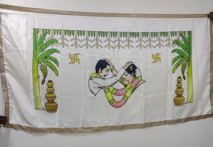 a banner hanging on the wall with an image of two people holding each other in front of palm trees