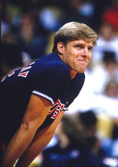 a close up of a baseball player holding a bat