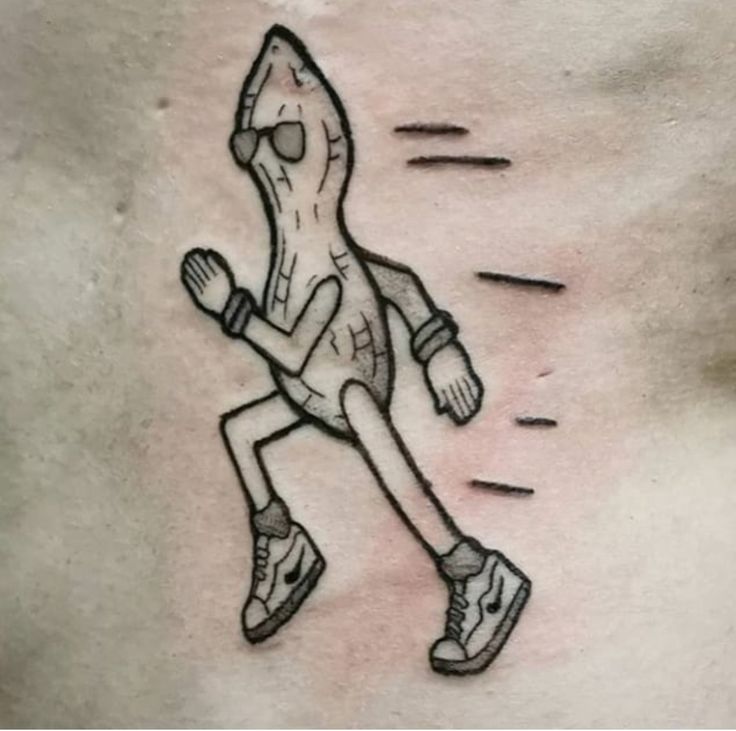 a man's chest with a drawing of a person riding a skateboard on it