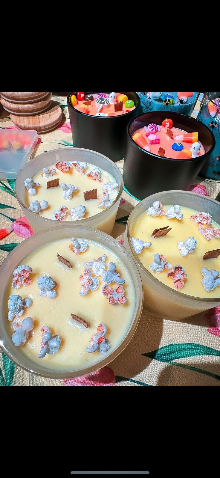 three bowls filled with dessert sitting on top of a table