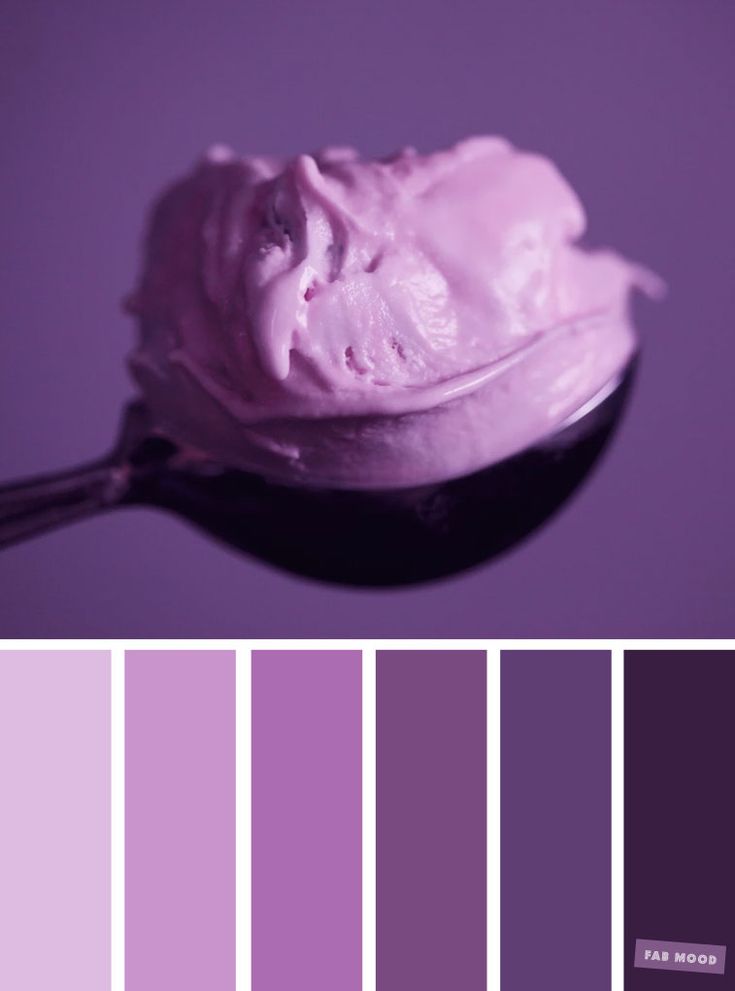 a spoon full of ice cream on top of a purple color swatch with different shades