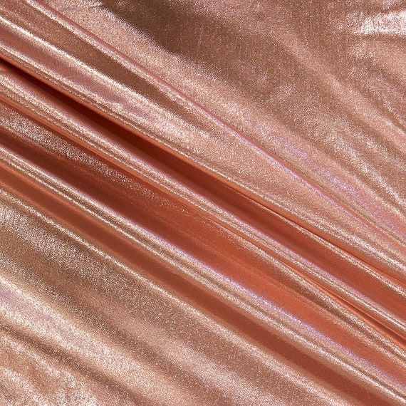 a close up view of a shiny pink fabric