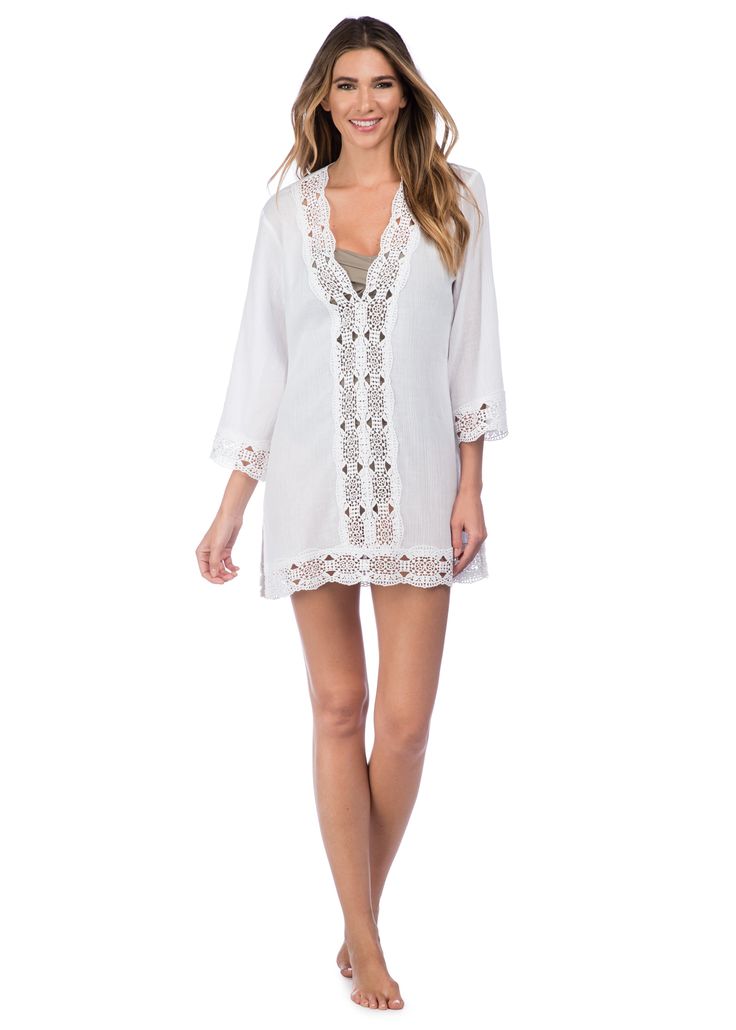 This lightweight cotton swimwear tunic by La Blanca features a crochet center panel in front to peep your swimsuit just beneath. Crochet trim along the neckline, cuffs and hem of this cover-up add a hint effortless elegance. [split] Details Swimwear cover up V neck tunic Crochet trim Long sleeves Fabric 100% Cotton (Crinkle voile) V-neck Beach Dress With Lace Trim, Chic Lace Trim Beach Cover-up, Beachwear Tops With Crochet Trim For Beach Cover-up, Vacation Swimwear With Crochet Trim And Stretch, Chic Split Neck Tops For The Beach, Fitted Beachwear Cover-up For Brunch, White Beachy Swimwear With Crochet Trim, Summer Beach Tops With Split Neck, Beachwear V-neck Cover-up For Daywear