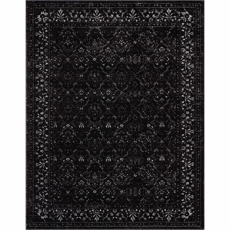 a black and white rug with an intricate design