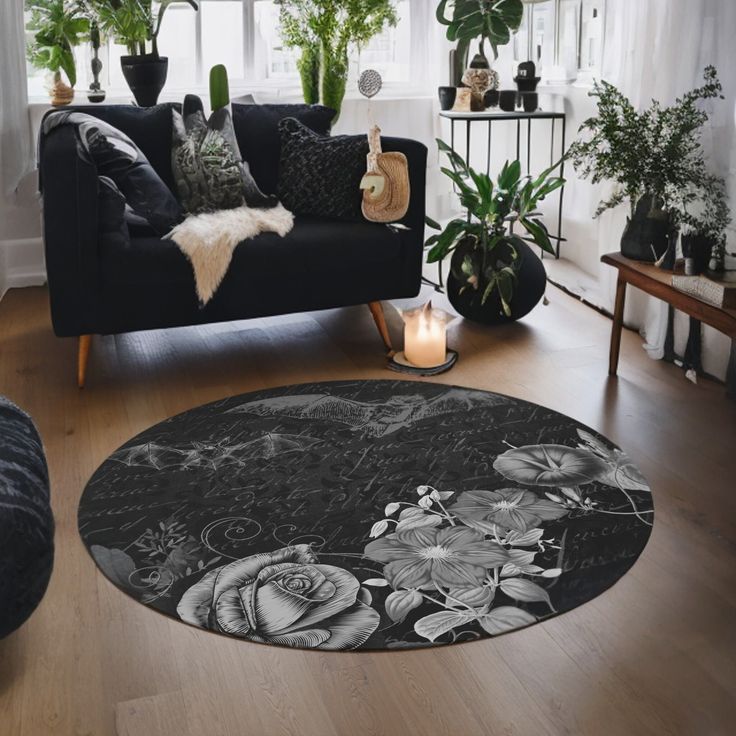 a black and white photo of a living room with flowers on the floor, plants in vases