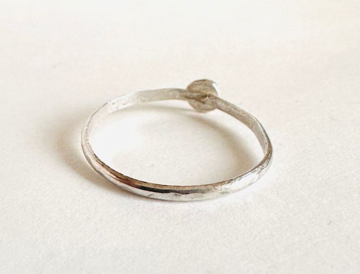 Size 9 stacking ring 4mm silver hammered circle soldered onto a 1.5mm hammered band Hammered Stackable Promise Rings, Hammered Stackable Round Promise Rings, Silver Stackable Rings With Hand Forged Round Band, Silver Hammered Stackable Promise Rings, Hammered Silver Stackable Promise Rings, Minimalist Hammered Silver Stackable Rings, Simple Hammered Rings, Hammered Sterling Silver Midi Rings, Hand Forged Dainty Stackable Rings