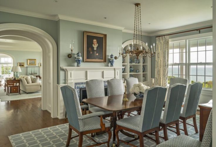 a dining room table with chairs and a chandelier