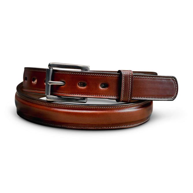 The Esquire is the favorite of the owner of Hanks Belts. Whether you are wearing dress pants or jeans the Esquire will complement your outfit with a slightly more refined style that is sure to impress. We start with the same English Bridle leather we use in our Canyon belt. The Esquire is then lined with premium leather so that you have the same quality inside and out. The 1.25” width is perfect for a sleeker look and fits the belt loops of all jeans or pants. The inside of the belt is raised wi Classic Hand-tooled Leather Belt, Luxury Artisan Hand-tooled Belt Buckles, Luxury Men's Semi-formal Belt Buckles, Luxury Leather Belt With Gold-tone Hardware, Work Belt, Vintage Brown Hand-tooled Belt Buckle, Biker Wallet, Casual Belt, All Jeans