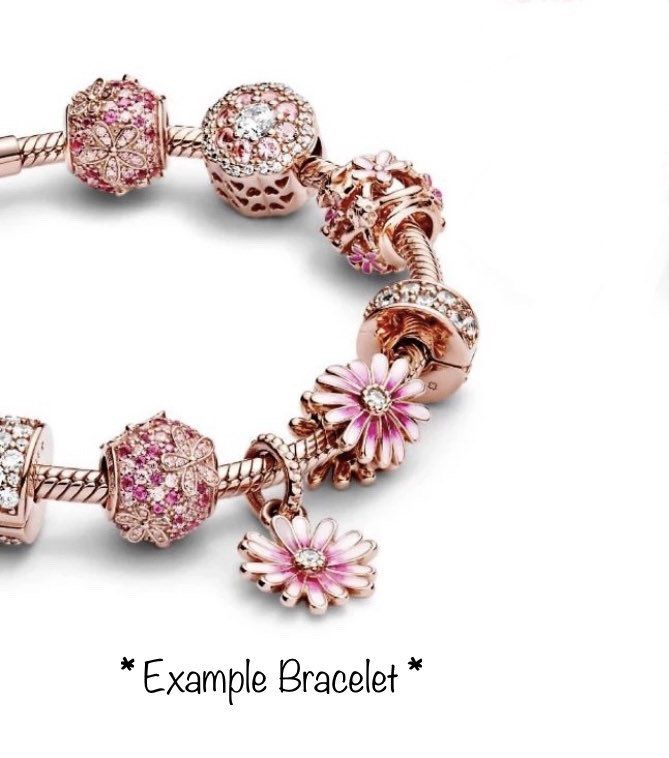 Absolutely gorgeous, 14k rose gold plated, openwork daisy charm with pink and white enamel daisies and rose gold ladybugs. Makes a lovely addition to your charm bracelet or as a gift for someone special. You can also place this charm on a chain for a simple, yet stunning necklace. This charm will fit all top brand charm bracelets including brands such as Pandora and Chamilia. It will also fit 3mm European snake chain charm bracelets. Hole: 4mm Charm Size: 12mm Listing is for charm only. Bracelet Pink Daisy Flower, Pandora Inspiration, Pandora Necklace, Daisy Charm, Daisy Bracelet, Rose Gold Beads, Turtle Charm, Pandora Bracelet Charms, Pink Sparkle