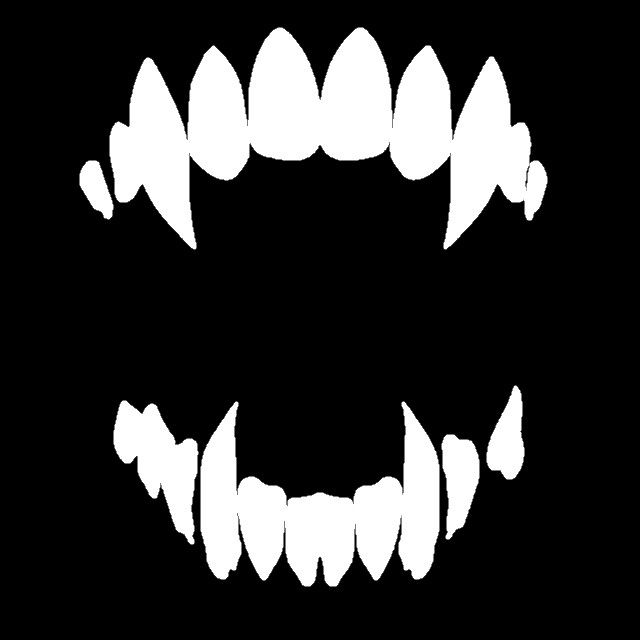 a black and white photo of the teeth of a monster's mouth with fangs