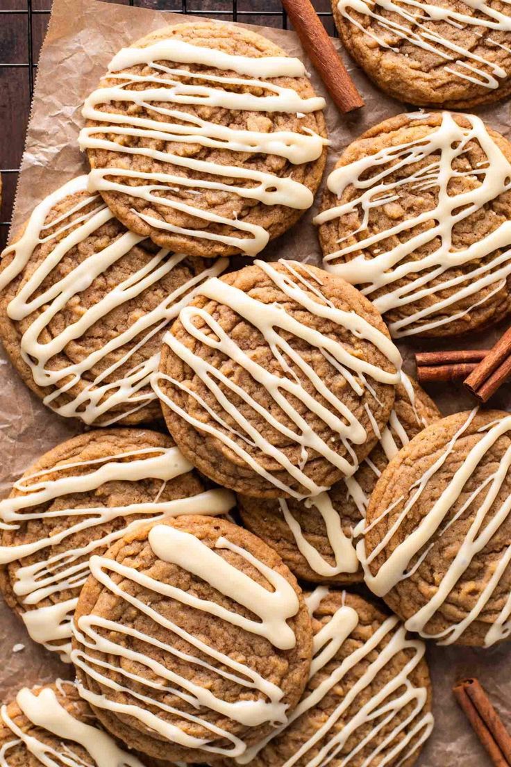 cookies with icing and cinnamon sticks on top