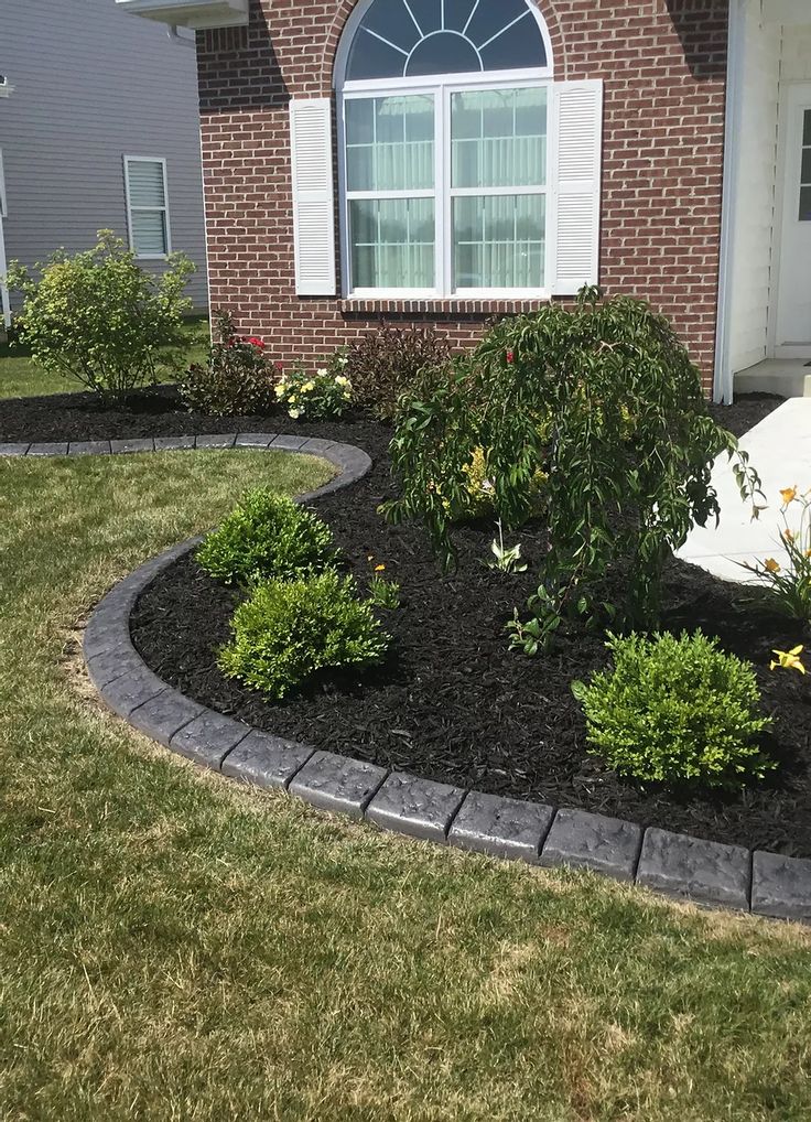 a house with landscaping in front of it