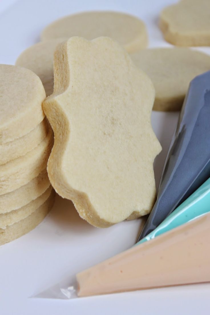 some cookies are sitting on a plate with toothbrushes and other items in the background