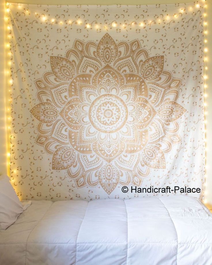 two pictures of a bed with lights on the headboard and an image of a wall hanging above it