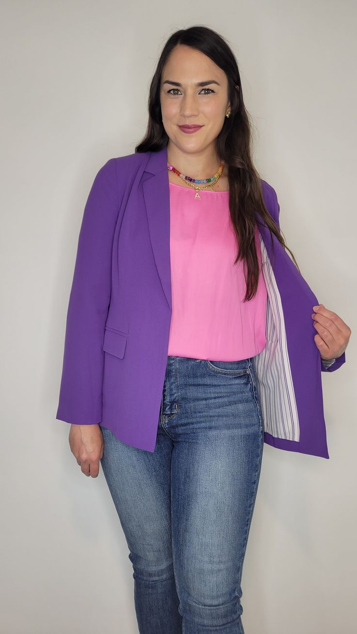 Details: The prettiest quality blazer to add to your closet! The purple is gorgeous and the lining throughout with purple and white stripes is the chef's kiss! The sleeves are full length, but can be cuffed to show off the beautiful lining. Pockets are functional and the flap can be tucked or untucked. Lightweight, comfortable, and smooth material. Light shoulder pads. Collared. Pair it with heels and dress pants or wear it more casual with jeans and sneakers. It would be perfect for kstate fans with a kstate graphic tee. Materials: Self: 100% Polyester. Lining: 95% Polyester, 5% Spandex Made In: China Sizing Tip: It fits like a traditional blazer. Meant to be more fitted. Order true to size or size up if inbetween. There is a little give to the material, but not much. I am 5’7” about 165 Cheap Purple Long Sleeve Blazer, Spring Purple Blazer With Button Closure, Fitted Purple Blazer With Buttons, Elegant Purple Double-breasted Blazer, Purple Single-breasted Long-sleeved Blazer, Classic Blazer, Purple And White, The Purple, Outerwear Sweater