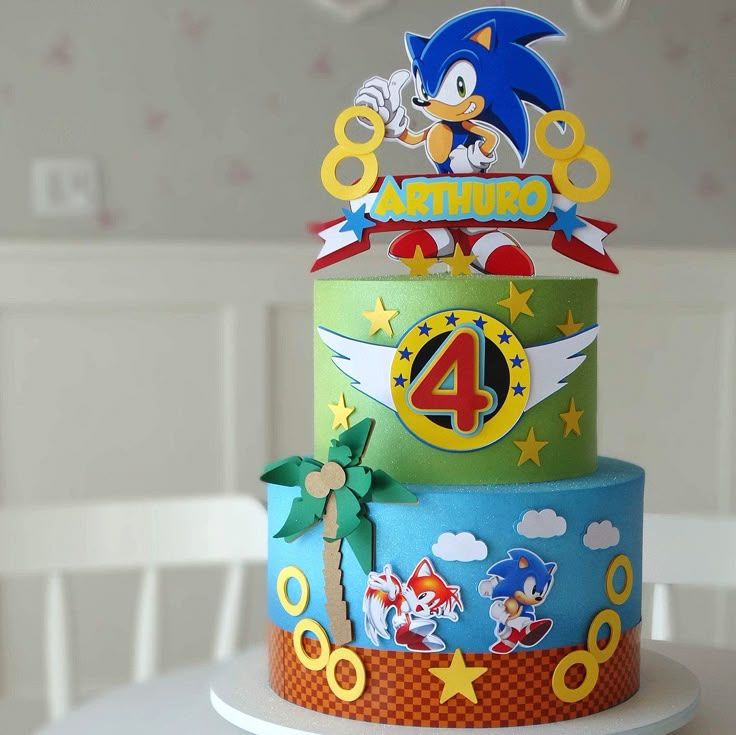 a birthday cake with sonic the hedge topper