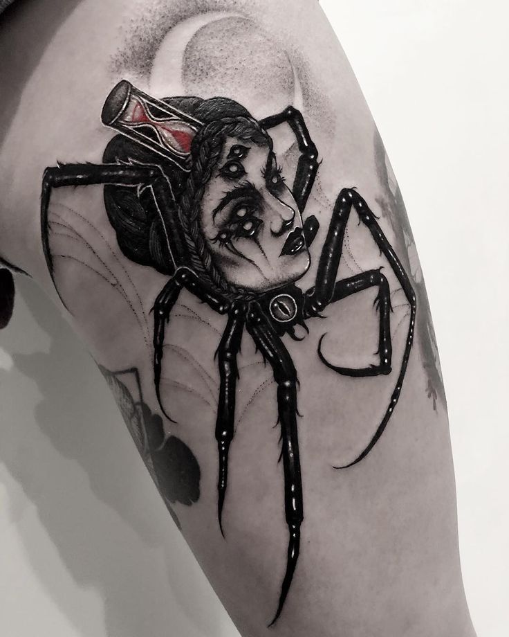 a man with a spider tattoo on his arm