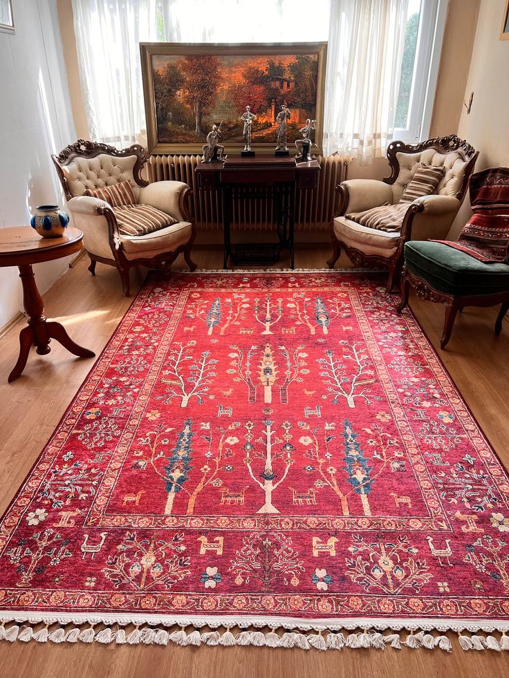 a living room filled with furniture and a red rug