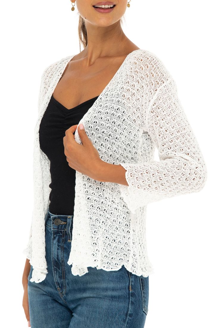 Pretty lightweight soft white cotton knit shrug can be worn tied or untied for two fashion looks. Perfect over tops, camisoles, blouses and dresses. This feminine cardigan also provides upper arm coverage for sleeveless tanks and dresses A versatile year around shrug that looks fabulous with any outfit. Pair with shorts, jeans, skirts, sundresses or over swimwear. A comfortable sweater to toss in your bag for a night out or when traveling. 100% cotton is as pretty as it is practical Flattering ¾ length sleeves have a gentle scalloped edge for a stylish silhouette. Available in classic neutral colors to compliment everything in your wardrobe. This will quickly become your go-to sweater to change up your look or add a quick and easy layer Easy care, easy wear. Machine wash cold. Lay flat to Shrugs With Jeans, Long Shrug, Textured Knit Cardigan, Knit Poncho Sweater, Knit Shrug, Cardigan Knit, Comfortable Sweater, Tie Front Cardigan, Soft Cardigan