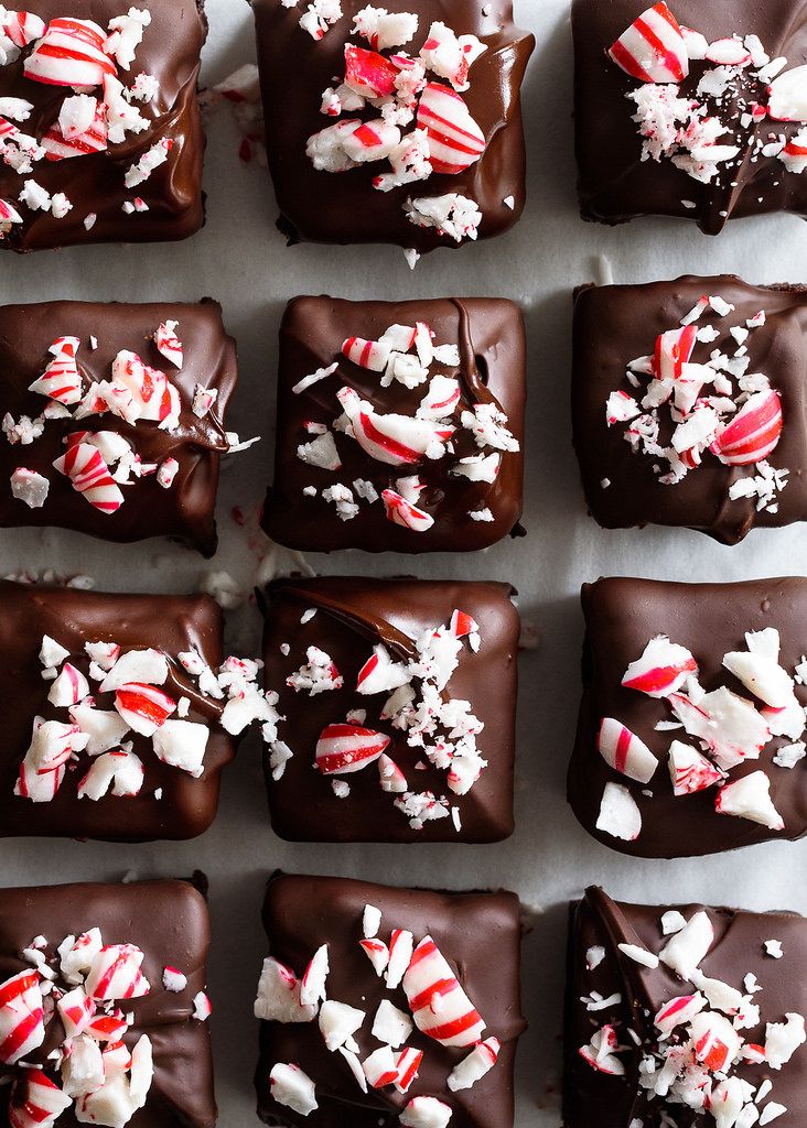 many pieces of chocolate with candy canes on them