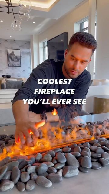 a man is grilling hot coals with the words coolest fireplace you'll ever see