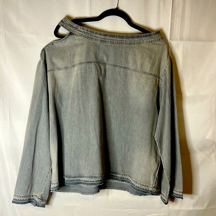 Long Sleeve Denim Shirt Gray From Zara Has One Shoulder Out Cold Shoulder, And A Strap Down The Back Has Buckles On The Back Of The Sleeves, Larger, Roomy Shirt And A Nice Faded Gray Denim Trendy Light Wash Long Sleeve Top, Trendy Light Colored Long Sleeve Tops, Long Sleeve Dark Wash Washed Denim Top, Long Sleeve Washed Dark Denim Top, Long Sleeve Dark Wash Denim Top, Long Sleeve Washed Blue Denim Top With Frayed Hem, Washed Blue Long Sleeve Denim Top With Frayed Hem, Casual Washed Denim Blouse, Light Wash Long Sleeve Casual Tops