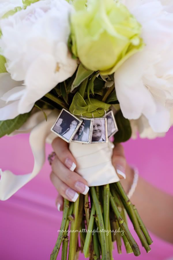 the bride's bouquet is adorned with photos and flowers