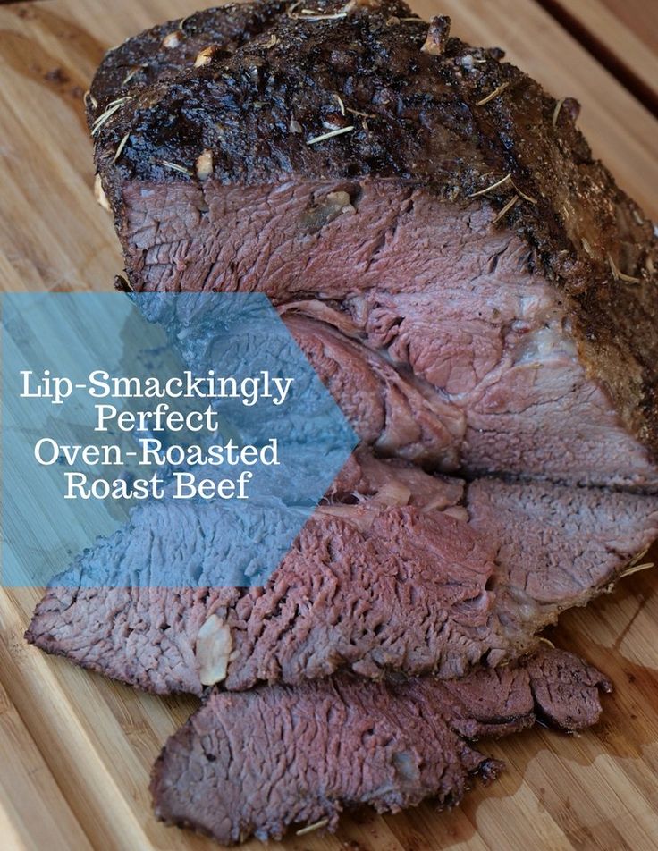 a piece of roast beef sitting on top of a wooden cutting board with the words lip - smackingly perfect oven roasted roast beef