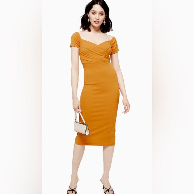 This Mustard Yelllow Midi Wrap Dress Features A Flattering And Ultra-Elegant Bardot Neckline. We Love The Timeless Style That This Piece Creates And Are Accessorizing It With A Mini Chic Handbag. 96% Polyester, 4% Elastane. Machine Wash. Yellow Short Sleeve Midi Dress For Evening, Elegant Yellow Bodycon Dress, Yellow Bodycon Dress With Short Sleeves, Yellow Bodycon Sheath Dress, Yellow Fitted V-neck Bodycon Dress, Fitted Yellow V-neck Bodycon Dress, Yellow Ruched Fitted Bodycon Dress, Fitted Ruched Yellow Bodycon Dress, Yellow Knee-length Bodycon Dress