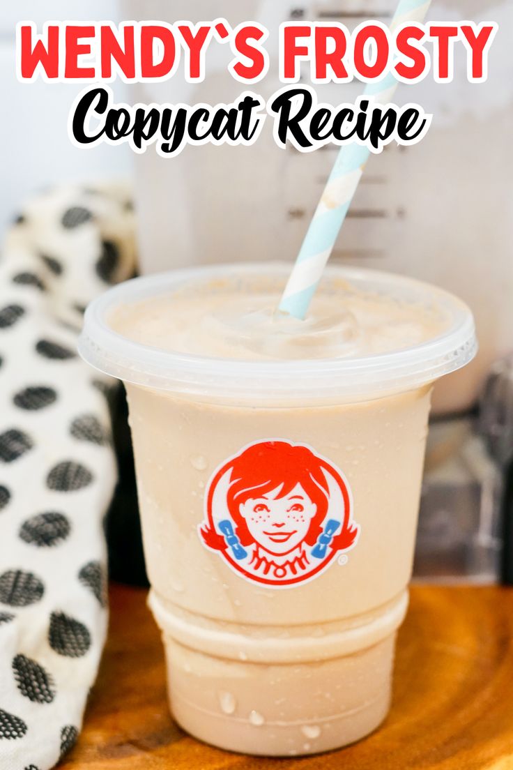 a plastic cup with a straw in it and the words wendy's frosty copycat recipe