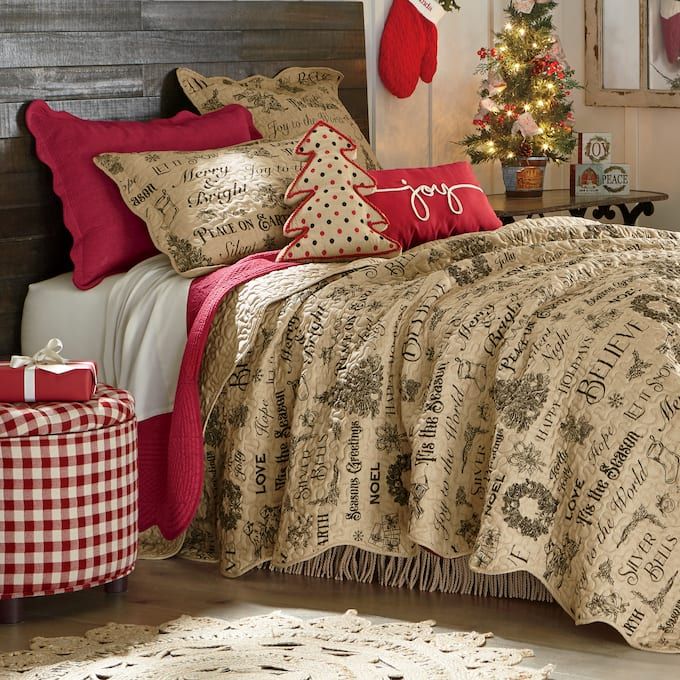 a bedroom decorated for christmas with red and white decor