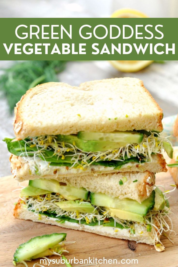 a green goddess vegetable sandwich is cut in half and stacked on top of each other