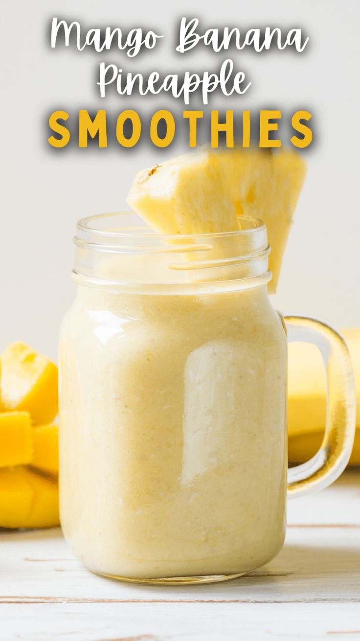 mango banana pineapple smoothie in a mason jar