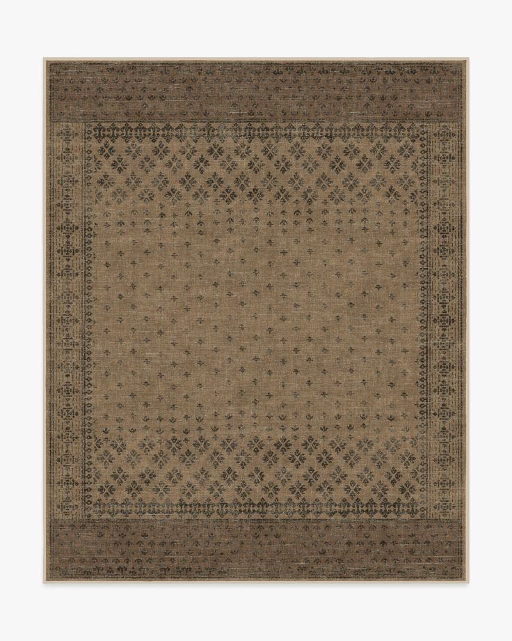 an area rug with brown and black designs on the bottom, in front of a white background