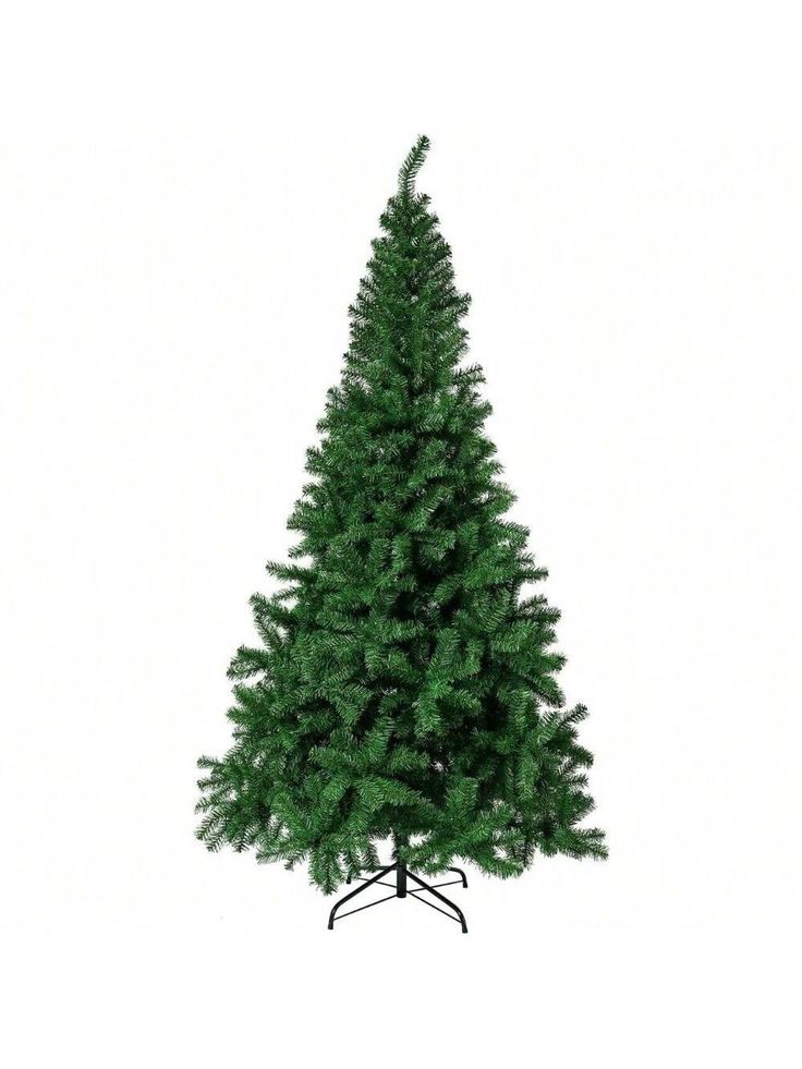 a small green christmas tree sitting on top of a white floor next to a black stand