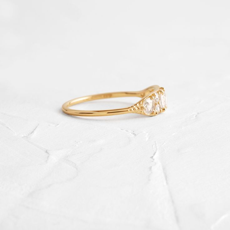 Seven SI clarity rose cut white diamonds (2-4mm) Solid 14k gold setting with a delicate 1.2mm round band (available in 14k yellow, white, and rose gold) We handcraft each piece with responsibly sourced 14k gold and ethically sourced stones. Dainty Cluster Ring With Rose Cut Diamonds For Promise, Dainty Promise Birthstone Ring With Rose Cut Diamonds, Cluster Ring With Rose Cut Diamonds For Promise, Dainty Cluster Ring With Single Cut Diamonds For Promise, Promise Ring With Rose Cut Diamonds Birthstone, Round Cut Rose Diamond Birthstone Promise Ring, Rose Cut Diamond Birthstone Promise Ring, Dainty Rose Cut Diamond Promise Ring, Diamond White Stackable Promise Rings With Rose Cut Diamonds