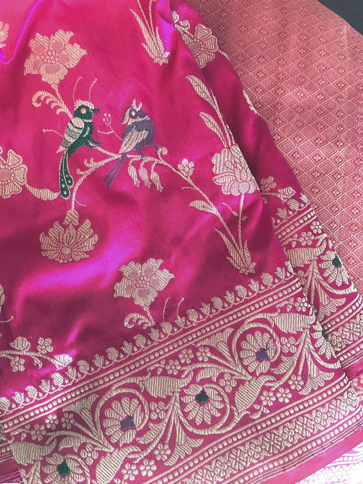 This pure katan silk banarasi saree is an epitome of beauty!. It is just too exquisite. Kudos to the craftsmanship of the weaver! This fuschia pink katan silk banarasi saree is woven in a fine kadwa weave. Saree has floral jaal motifs with meenakari motifs including bird motifs. Pallu and borders have kadwa meenakari floral motifs.  Kadhua/kadwa technique is a laborious process with each motif woven separately and takes both time and high level of skill. This is a saree that can be passed on to Rani Pink Banarasi Saree, Chunni Designs, Pink Banarasi Saree, Banarasi Fabric, Katan Saree, Silk Banarasi Saree, Banaras Sarees, Banarsi Saree, Printed Linen Fabric