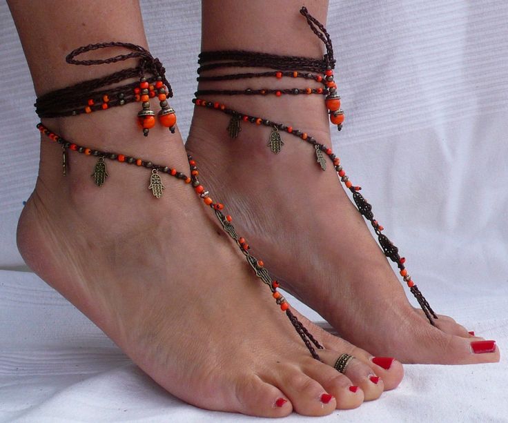 This listing is for a PAIR of barefoot sandals and ONE toe ring. Beautiful and unique barefoot sandals with a ethnic vibration. They look great as necklace or on the hands too :) Handmade crochet with love and care using waxed polyester cord, antique bronze hamsa hands connectors and charms, glass beads and brass beads. The lace is long enough to wrap it 2 times around the leg. Each end of the string is closed with glass beads, acai seed beads and brass beads. These resistant sandals are suitabl Handmade Ankle Strap Barefoot Sandals As Gift, Handmade Barefoot Sandals With Ankle Strap As Gift, Handmade Adjustable Toe Ring Anklets, Adjustable Beaded Bohemian Barefoot Sandals, Hippie Toe Ring Anklets For The Beach, Bohemian Toe Ring Anklets For Beach, Handmade Bohemian Anklets With Ankle Strap, Bohemian Handmade Anklets With Ankle Strap, Bohemian Handmade Ankle Wrap Anklets