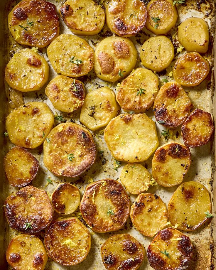 baked potatoes in a baking dish with herbs