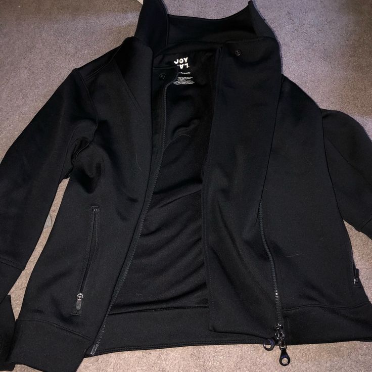 Black Cute Soft Jacket That Zips Up With Pockets. New Without Tags Black Fleece Jacket With Pockets For Work, Fall Black Track Jacket With Zipper Closure, Black Track Jacket With Zipper For Fall, Black Techwear Track Jacket For Fall, Black Techwear Fleece Jacket For Fall, Black Fleece Jacket With Zipper Closure, Black Long Sleeve Fleece Jacket With Zipper, Casual Black Fleece Jacket For Layering, Black Fleece Jacket For Fall Layering