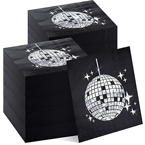 three black napkins with silver disco ball and stars on them