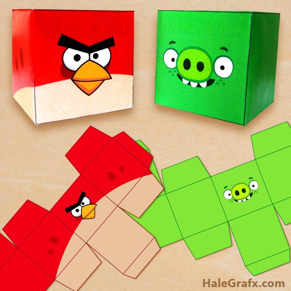 three angry birds made out of paper on top of a wooden table next to an origami box