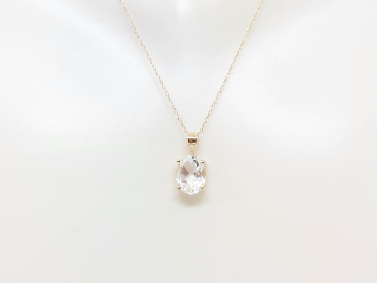 WHITE TOPAZ 2.05ct Pendant 14k Yellow Gold Pendant / Necklace. Natural Stone. 14k Yellow Gold 18" Rope Chain Necklace. Oval White TOPAZ lover. Product Info: - Stone: Oval White Topaz. - Pendant Measures: 14mm x 5mm. - Stone Measures: 7x5 - Stone Carat: 2.05ct - Metal: 14k Yellow Gold. - Chain Length: 18 inches Rope Chain. - Made in USA. - Nice Gift Box Included. White Diamond Necklace With Oval Shape For Anniversary, White Oval Necklace With Prong Setting, White Oval Solitaire Necklace For Anniversary, Oval Solitaire Necklace For Anniversary, White Pear-shaped Solitaire Necklace With Brilliant Cut, White Oval Solitaire Necklace With Diamond Cut, White Oval Diamond Cut Solitaire Necklace, White 14k Gold Solitaire Necklace For Wedding, Classic White Solitaire Necklace As Gift